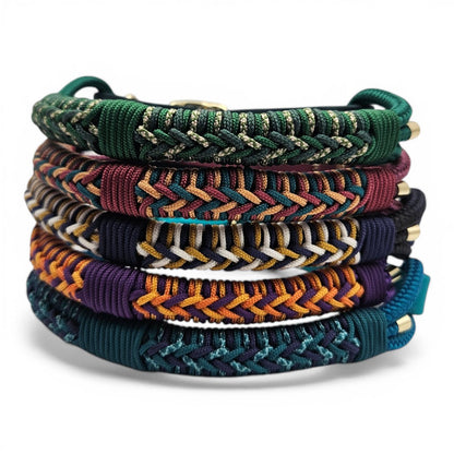 Stack of colorful braided bracelets on a white background