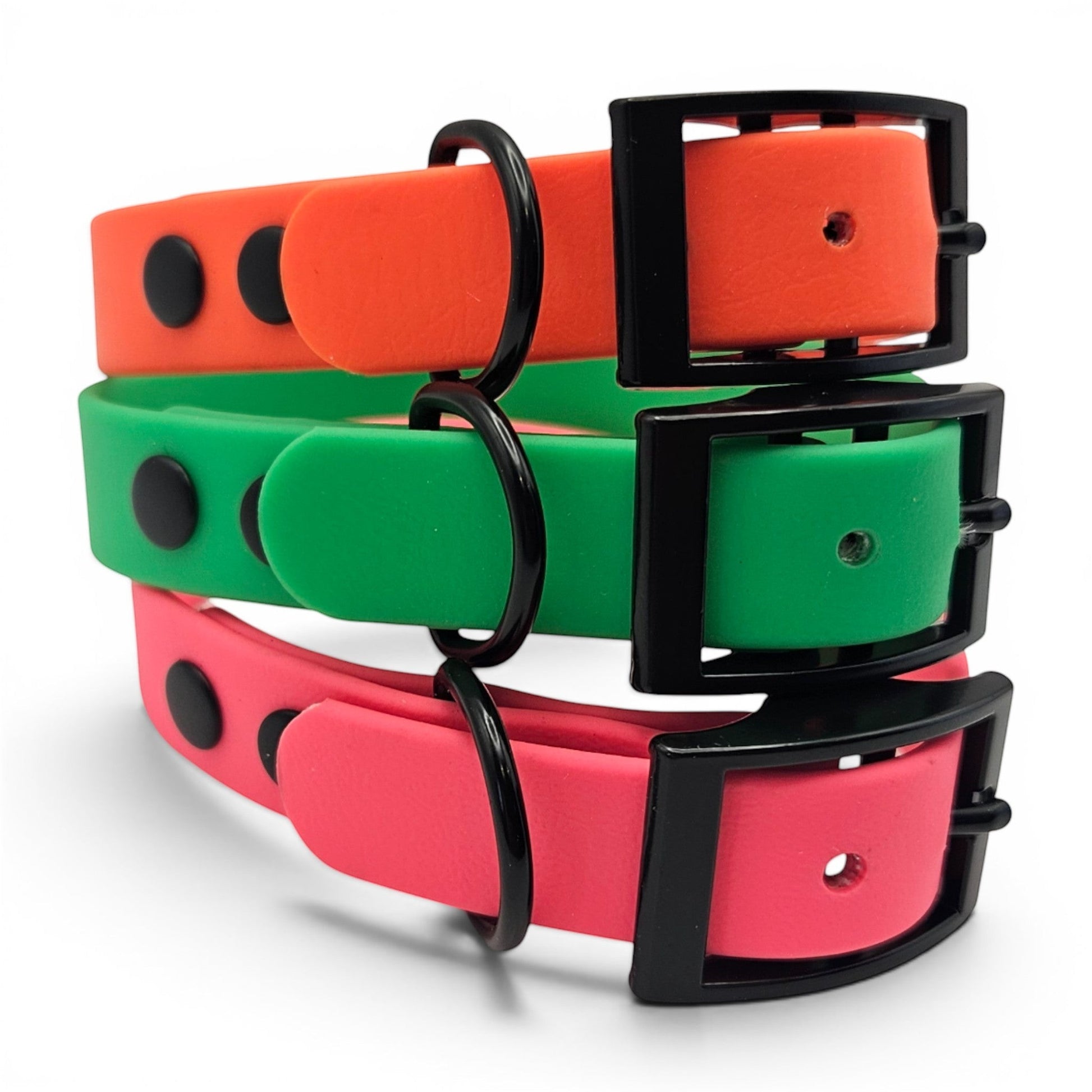 Ponies and Pups adjustable BioThane dog collars in orange, green, and pink with black hardware. Waterproof and handmade.