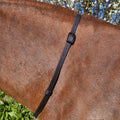 Ponies and Pups black BioThane adjustable neck strap on a brown horse. Waterproof and stink-proof.