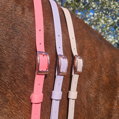 Ponies and Pups BioThane adjustable neck straps in pink, lilac, and cream with rose gold buckles on a horse.