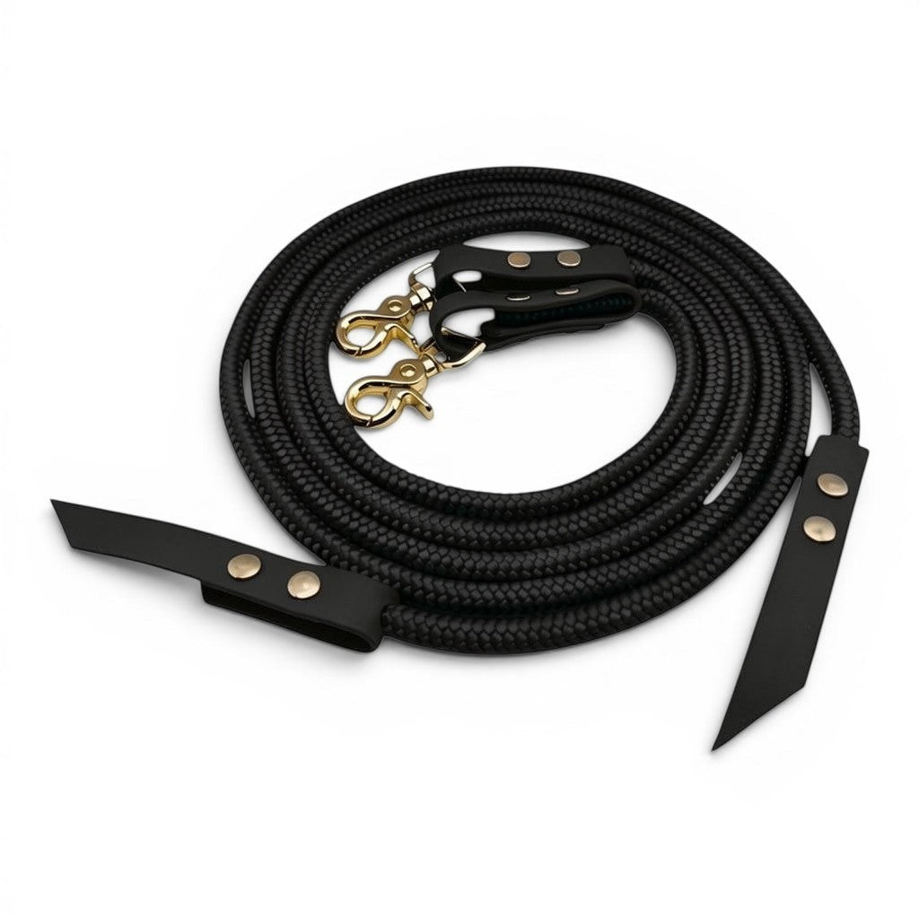 Ponies and Pups black rope split reins with durable BioThane ends and gold swivel clips for equestrian riding.