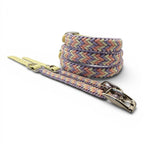 Ponies and Pups Wilmington handmade braided dog collar in pastel pink, purple, and cream with a yellow BioThane strap and silver buckle.