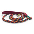 Ponies and Pups handmade braided dog lead with maroon BioThane handle and colourful rope. Features brass hardware.
