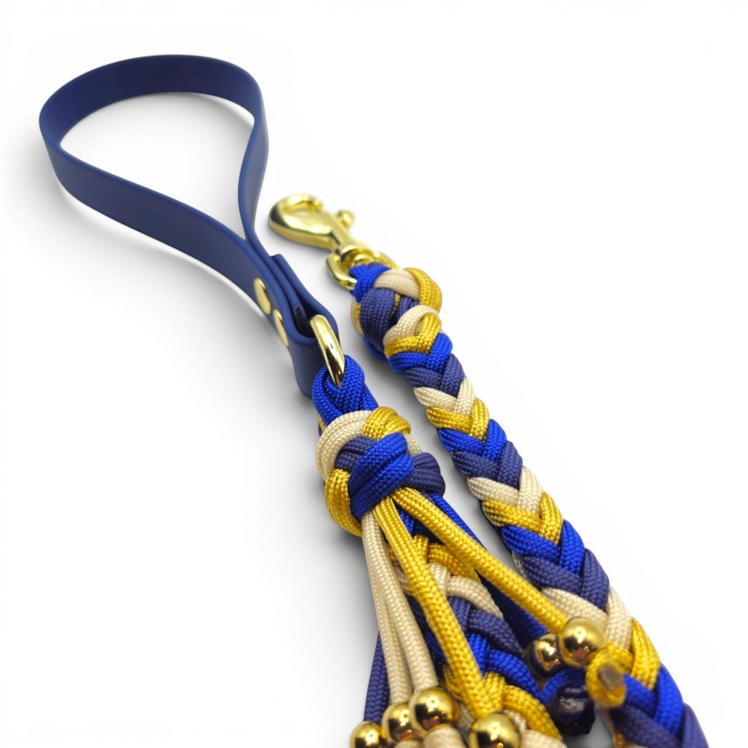 Ponies and Pups navy blue BioThane handle dog lead with braided blue, gold, and cream paracord and gold hardware.