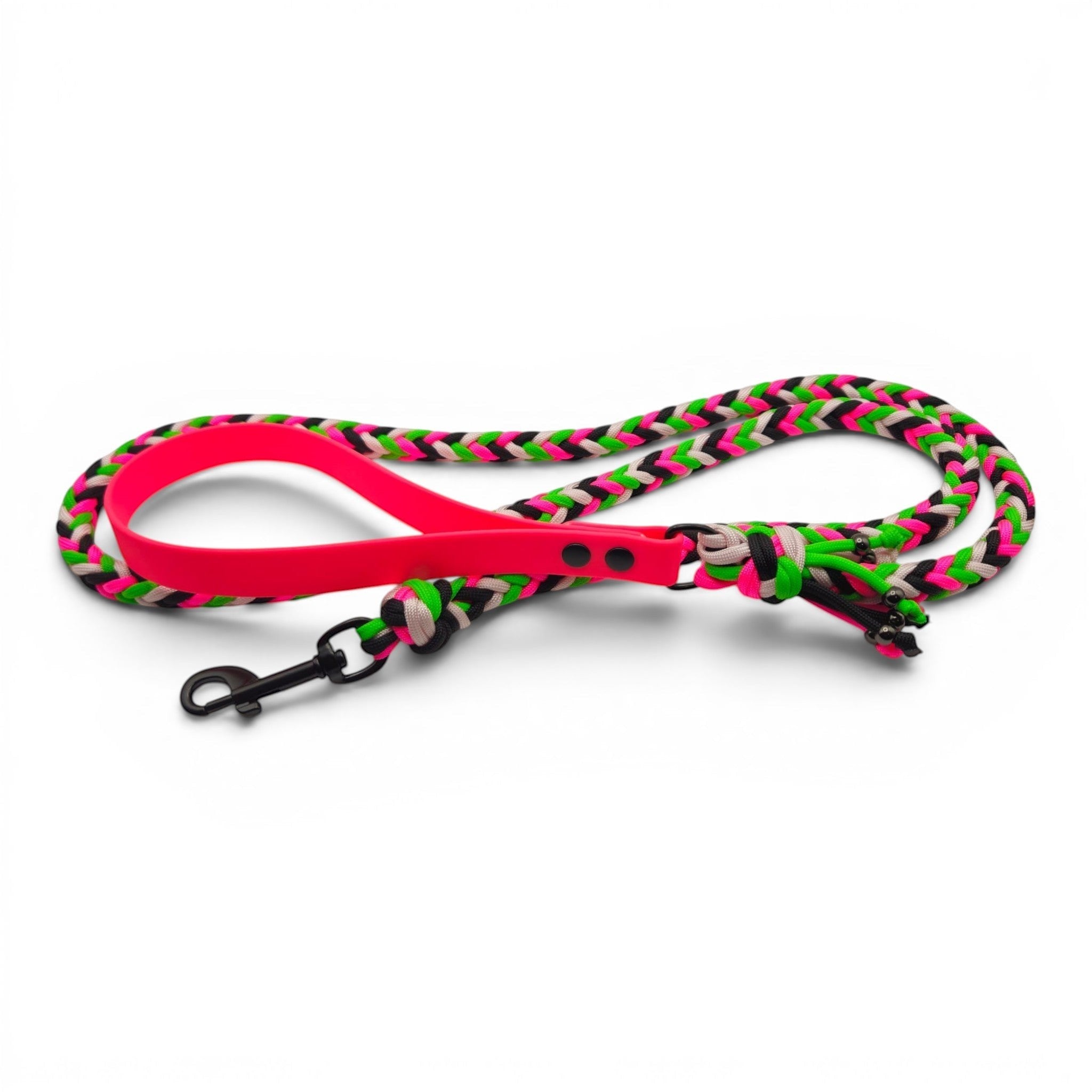 Ponies and Pups handmade braided dog lead with neon pink BioThane handle and black, neon green, and white paracord. Features a metal snap hook.