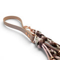 Ponies and Pups handmade braided dog lead with beige BioThane handle and rose gold hardware. Features a multi-color rope leash in pink, brown, and sage.