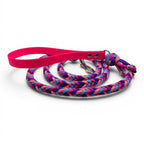 Ponies and Pups handmade braided dog lead with pink BioThane handle and purple, pink, and blue rope. Features metal snap hook.