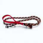 Ponies and Pups handmade braided dog lead with red BioThane handle, black, grey, and red paracord, and metal snap hook.