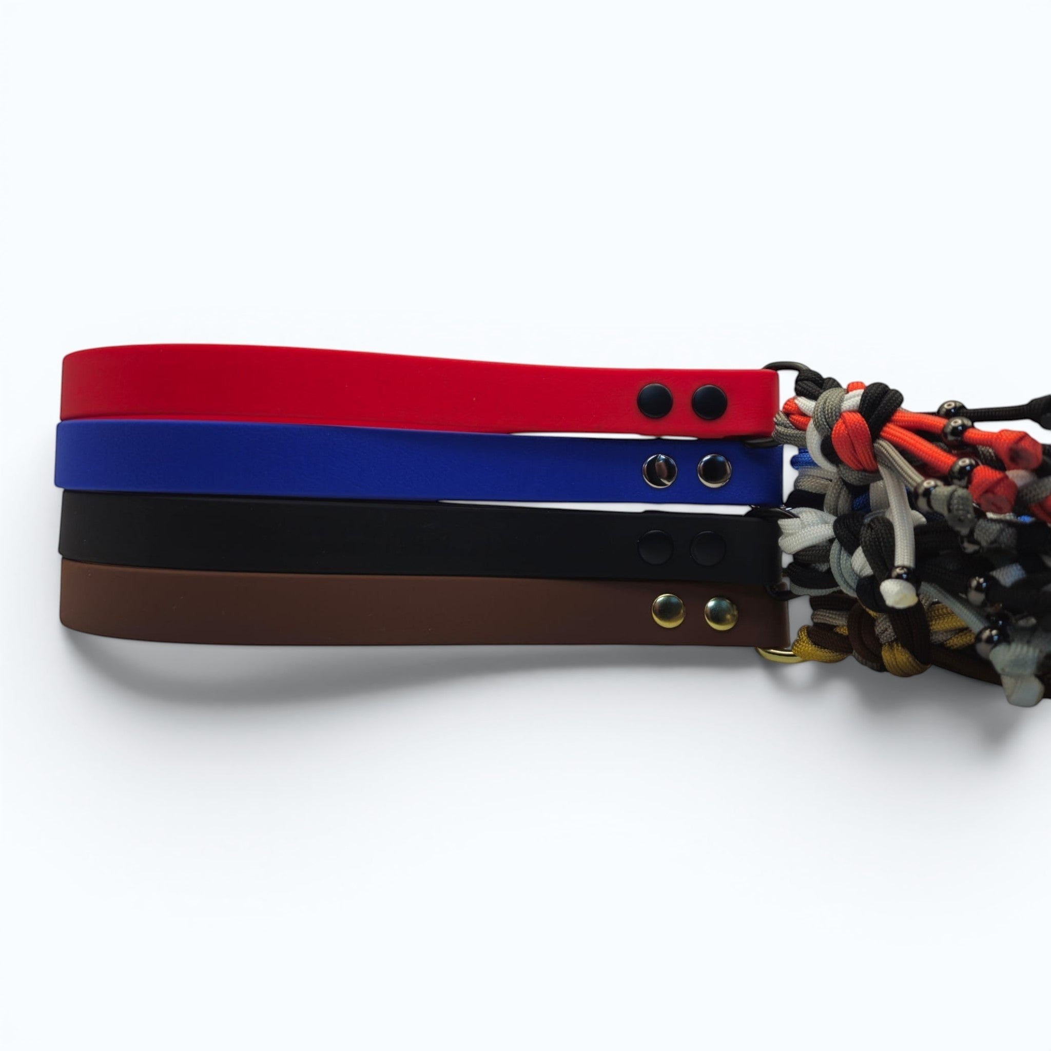 Ponies and Pups handmade braided dog lead in red, blue, black, and brown BioThane with colourful paracord ends and metal snap hooks.