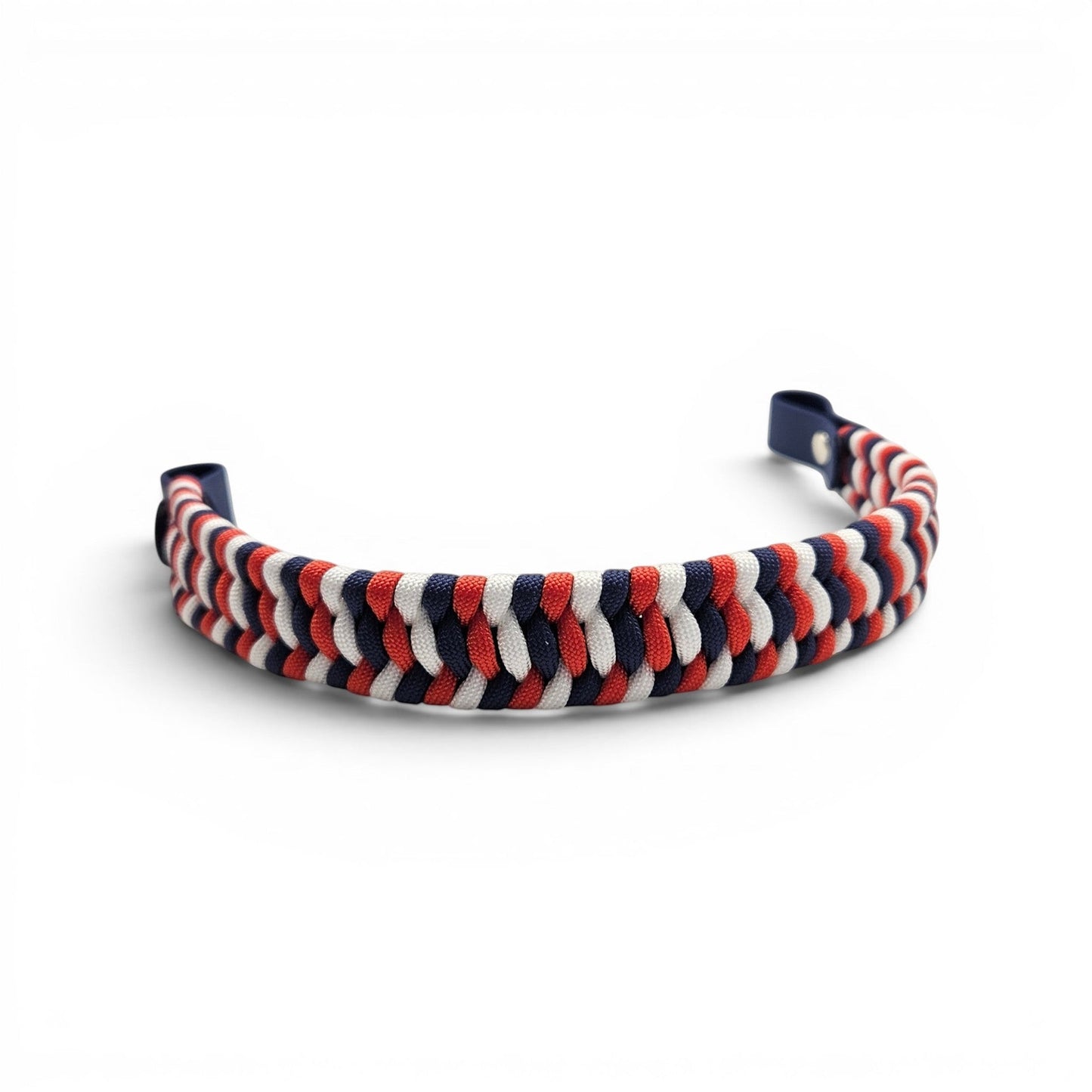 Ponies and Pups flat hunter style browband in a red, white, and navy blue braided paracord with BioThane loops.