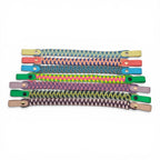 Ponies and Pups custom 3-colour paracord and BioThane browbands in various vibrant shades with metallic hardware.