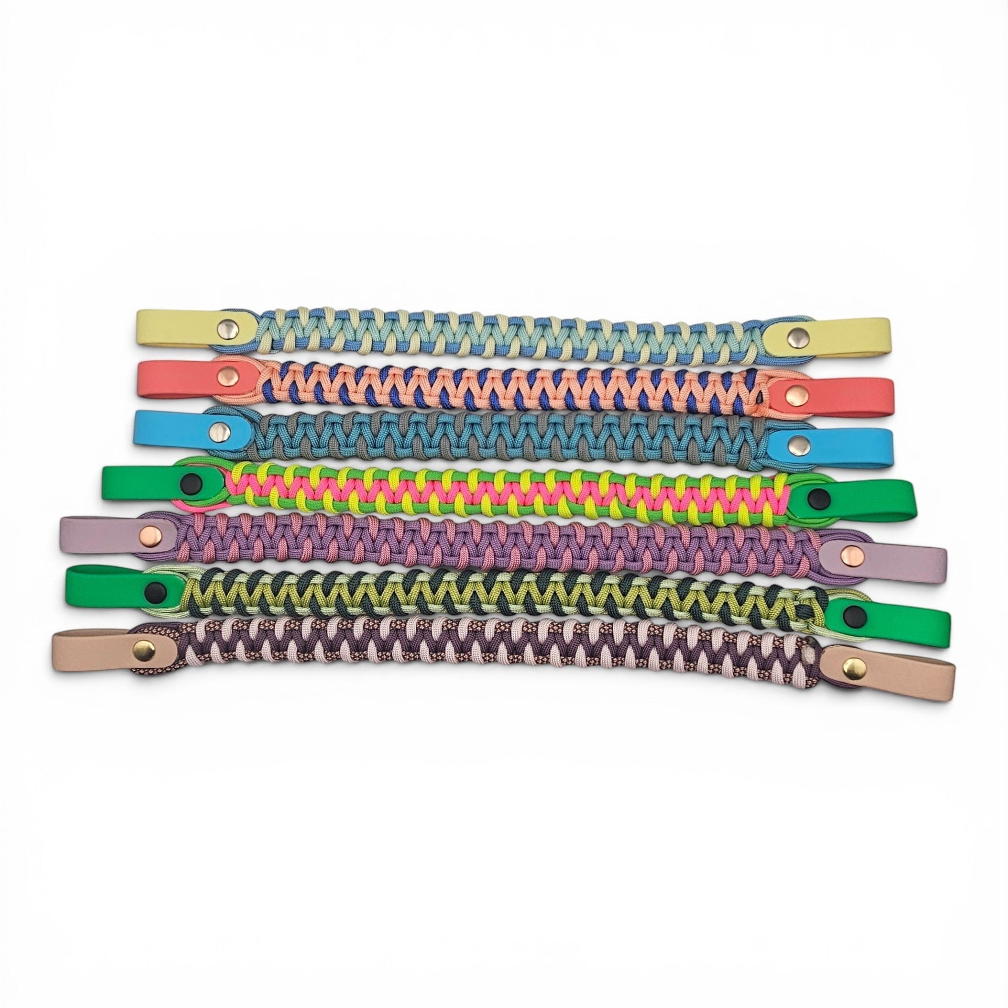 Ponies and Pups custom 3-colour paracord and BioThane browbands in various vibrant shades with metallic hardware.