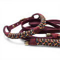 Ponies and Pups Firle dog collar in burgundy BioThane with braided paracord detail in burgundy, teal, and gold.