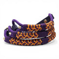 Ponies and Pups Firle dog collar with purple and orange braided paracord and dark purple BioThane strap.