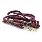 Ponies and Pups Firle dog lead in burgundy with braided herringbone detail and gold hardware. Features BioThane handle and PPM rope.