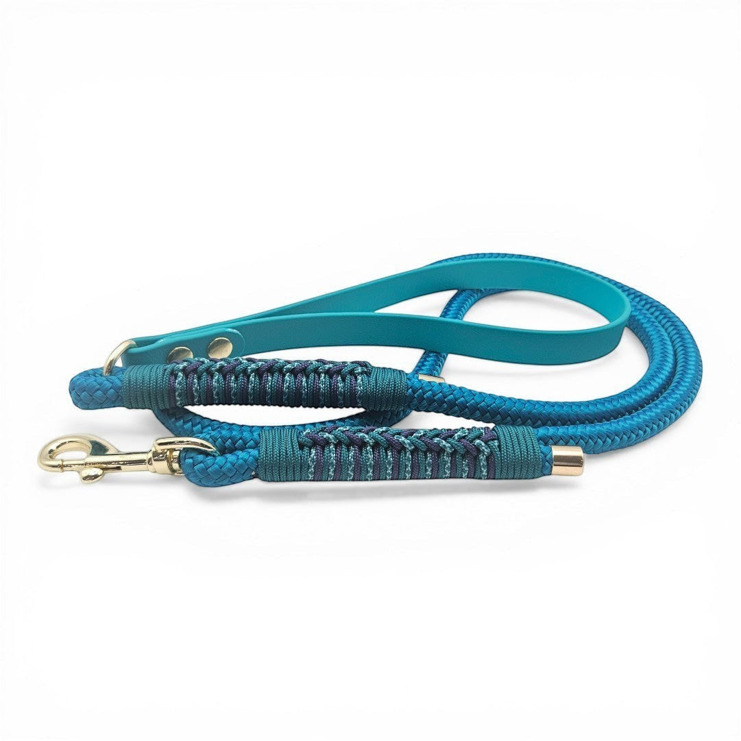 Ponies and Pups Firle dog lead in teal and blue with braided detail and gold hardware. Features BioThane handle and PPM rope.