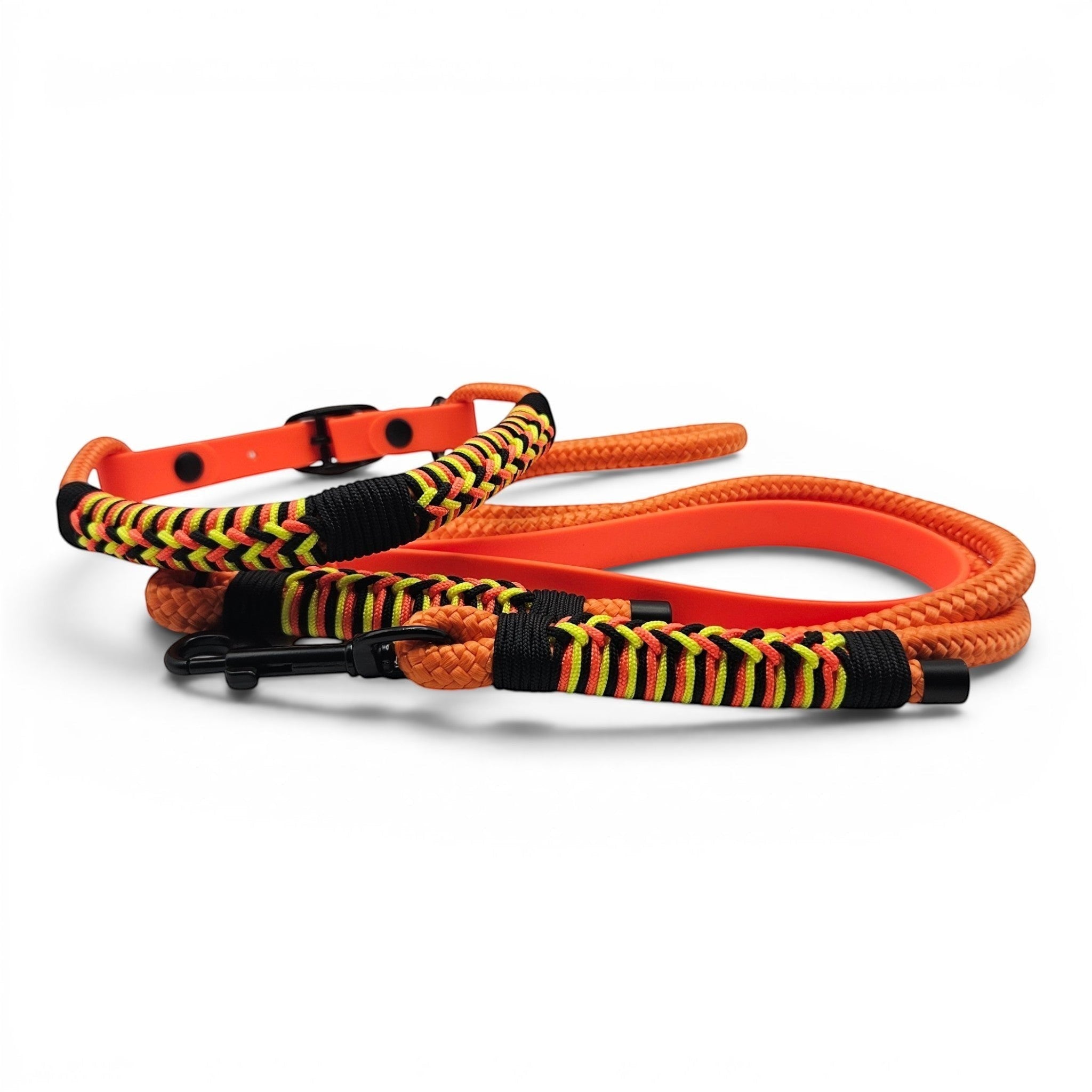Ponies and Pups orange dog lead with black, yellow, and red braided detail and matching collar. Weatherproof BioThane handle.