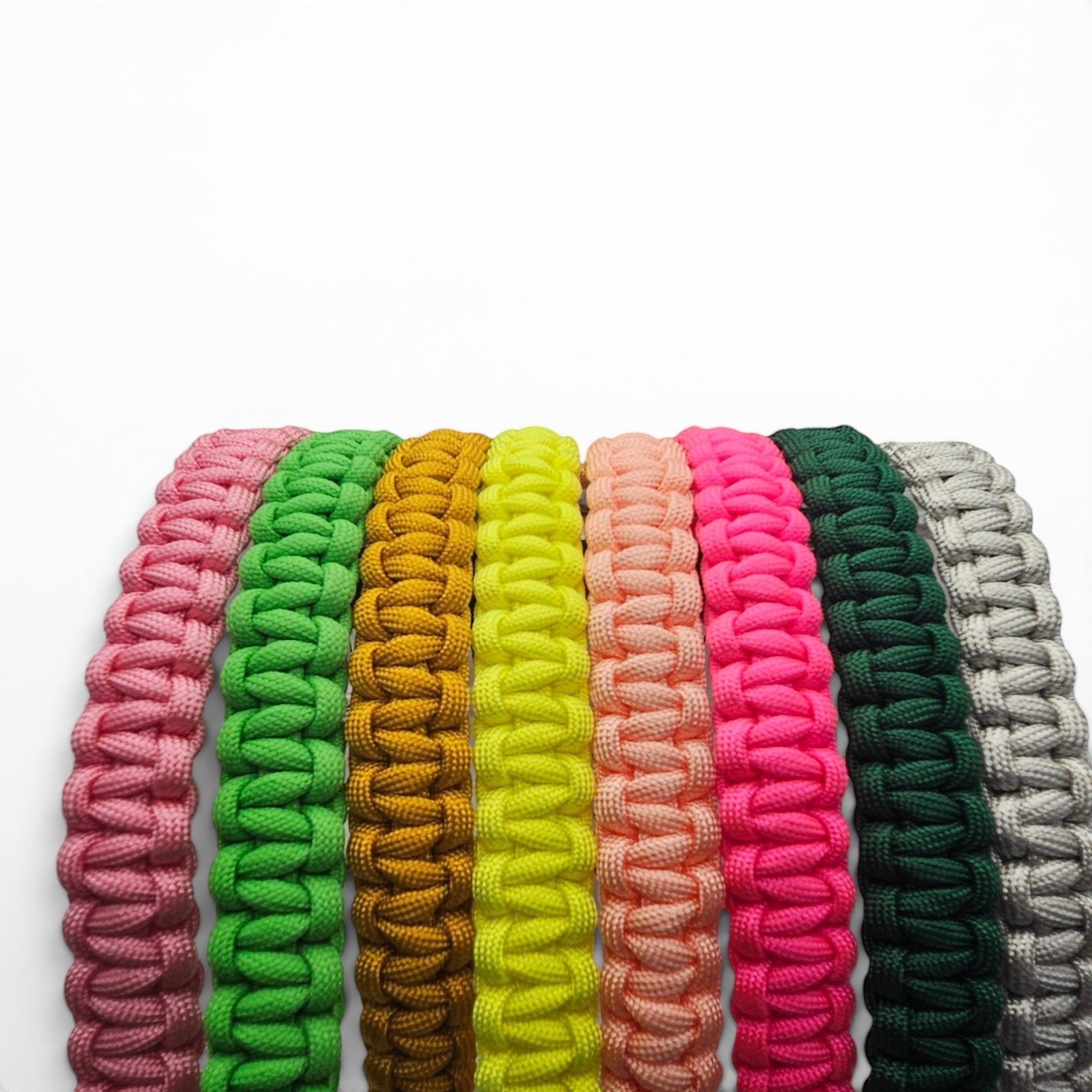 Ponies and Pups custom paracord browbands in a variety of vibrant colours including neon green, pink, and gold.