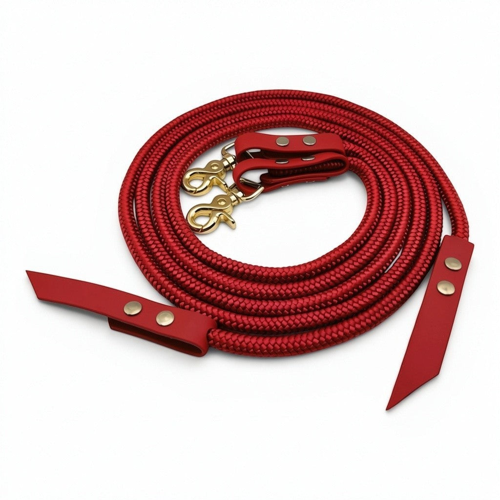 Ponies and Pups red rope and BioThane split reins with gold swivel clips and Chicago screw fixings on a white background