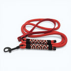 Ponies and Pups red weatherproof BioThane and braided PPM rope dog lead with herringbone paracord detail and black snap hook.